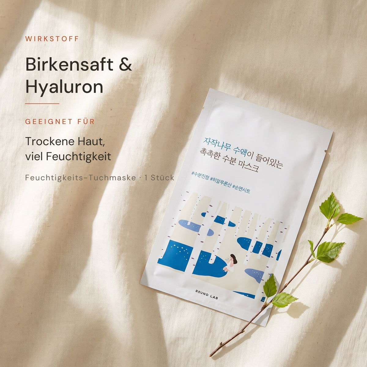Round Lab Birch Juice Maske auf hellem Leinen mit Birkenzweig, Hinweis auf Birkensaft und Hyaluron